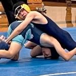 Luke Caputo/Kitsap News Group photos
Bremerton Knight Kode Kulrat pins a Gig Harbor wrestler in a meet Dec. 11 at Bainbridge High School.