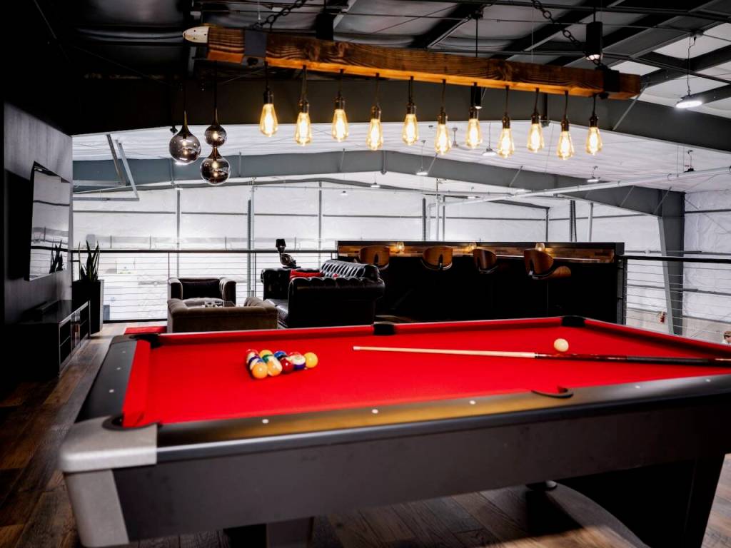 Amenities include a custom-built pool table.