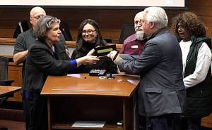 BKAT courtesy photo
Poulsbo Mayor Becky Erickson is presented with a key to the city at the Dec. 17 City Council meeting.
