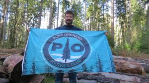 POFC courtesy photo
POFC head coach Max Sampson holds the POFC flag.