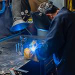 A young metalworker welds during a Youth: Weld a Metal Pet class at BARN. Courtesy BARN