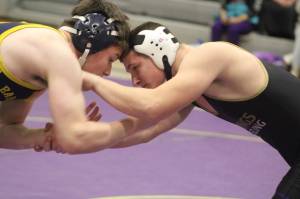Luke Caputo/Kitsap News Group photos
Viking Tristen Hosterman grapples with Bainbridge Spartan Enzo Roa during a Jan. 22 wrestling meet at North Kitsap High School.