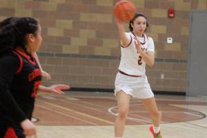 Luke Caputo/Kitsap News Group
Buccaneer Taizah Franklin passes the ball to a teammate in a 53-38 Kingston home win over Franklin-Pierce Feb. 14 in the first round of the District 3 2A girls basketball tournament.