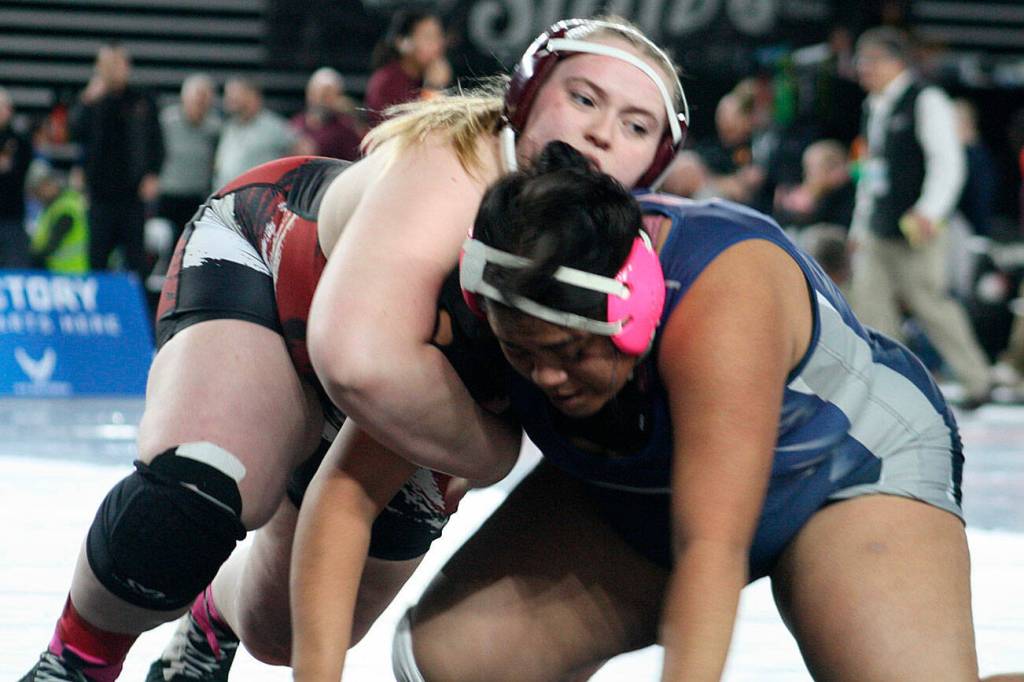 Elizabeth Hayden of South Kitsap wrestles against Skyview Eagle Madisyn Cardens in the girls 4A 235-pound championship match at the state wrestling Mat Classic Feb. 20 at the Tacoma Dome.