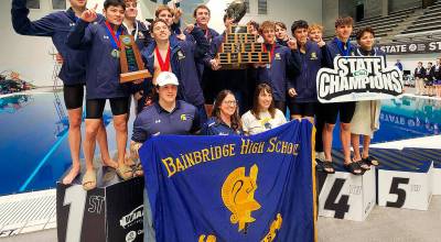 Krista Pal courtesy photo
The Bainbridge Spartans celebrate their first-place finish at the 1A/2A boys state swim/dive championships Feb. 21 at the King County Aquatic Center in Federal Way.