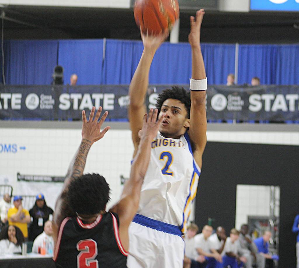 Knight Aaron Matthews puts up a shot in a 45-43 Bremerton win over the R.A. Long Lumberjacks in the 2A boys state championship March 7 at the Yakima SunDome.