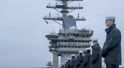 U.S. Navy courtesy photo by Petty Officer 2nd Class Peter McHaddad
Sailors man the rails on the flight deck of the USS Nimitz (CVN 68) during the ships final departure from Naval Base Kitsap in Bremerton March 7.
