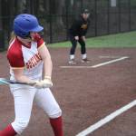 Luke Caputo/Kitsap News Group photos
Buccaneer Abi Waag swings at an incoming pitch in a 10-9 Kingston win over Central Kitsap March 13 in Silverdale.