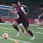 SK senior midfielder Yuji Ehret pushes the ball downfield in a 3-2 home loss to Battle Ground March 27 in Port Orchard.
