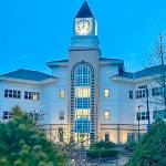 The clock tower atop Port Orchard City Hall. It overlooks Sinclair Inlet and the citys waterfront, and chimes every 15 minutes.