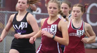 Luke Caputo/Kitsap News Group photos
Demi Morton and Madison Broga of SK compete in the girls 3200-meters during a track and field meet against the Puyallup Vikings April 3 in Port Orchard.