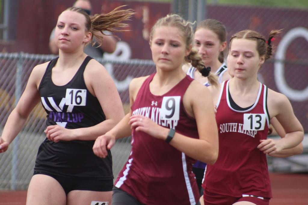 Luke Caputo/Kitsap News Group photos
Demi Morton and Madison Broga of SK compete in the girls 3200-meters during a track and field meet against the Puyallup Vikings April 3 in Port Orchard.