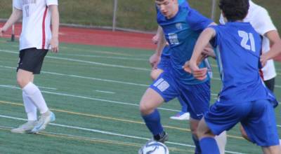Luke Caputo/Kitsap News Group
Trojan Chase Ellis (middle) scored two second-half goals to give Olympic its first league win of the season at home against Kingston April 3.