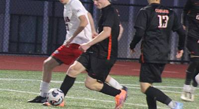 Luke Caputo/Kitsap News Group
Cougar Wyatt Bell tries to keep the ball away from a defender in a 2-1 CK home loss to Silas Rams April 7.