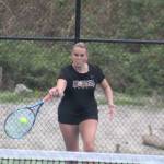 Viking Abby Knott hits a forehand during a doubles match in a 5-2 NK win over the Olympic Trojans April 21 in Bremerton.