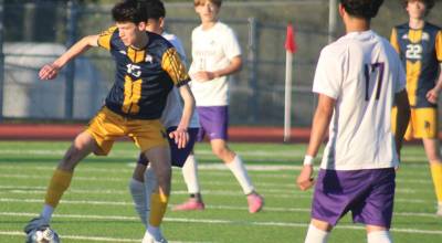 Luke Caputo/Kitsap News Group photos
Spartan Eli Duggan dribbles the ball with Viking defenders enclosing during a 2-0 Bainbridge home win over North Kitsap April 29.