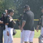 Wolves head coach Nick Kenyon talks with his team during a mound visit in a 4-1 SK road loss to Bonney Lake in the first round of the 2026 SPSL 4A Baseball Tournament May 5.