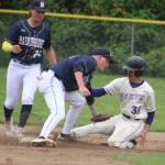 Luke Caputo/Kitsap News Group photos
Spartan Henry Olsen tags out a Viking baserunner during a 7-3 Bainbridge win over North Kitsap May 6 in Poulsbo.