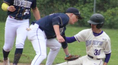 Luke Caputo/Kitsap News Group photos
Spartan Henry Olsen tags out a Viking baserunner during a 7-3 Bainbridge win over North Kitsap May 6 in Poulsbo.