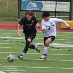 Viking Nolan Bond vyes for the ball with a Bulldog player during NKs 2-0 win over North Mason in the first round of the 2026 District 3 2A Boys Soccer Tournament May 9 in Poulsbo.