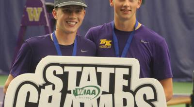 Luke Caputo/Kitsap News Group photos
NK Vikings Grady DeVries (left) and Rocco Targett (right) holding the state champs sign after winning their title match in boys doubles May 23 at the Nordstrom Tennis Center at the University of Washington in Seattle.