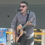 Bremerton native Mike Herrera of MxPx performs at Quincy Squares Fan Zone in Bremerton June 12 before the World Cup match between USA and Paraguay.