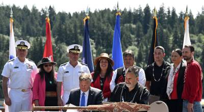 Suquamish Tribe courtesy photo
Surrounded by leaders from both the U.S. Navy and the Suquamish Tribe, Brendan Rogers, Assistant Secretary of the Navy – Energy, Installations and Environment, and Tribal Council Chairman Leonard Forsman sign the Memorandum of Agreement June 27.