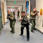 During the mock exercises, officers were in full uniform and armed with guns loaded with special BB-type pellets that leave a blue mark where they hit.