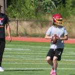 Buccaneer Connor Mutch drops back to pass with head coach Levi Andrew looking on during a Kingston practice session July 28.